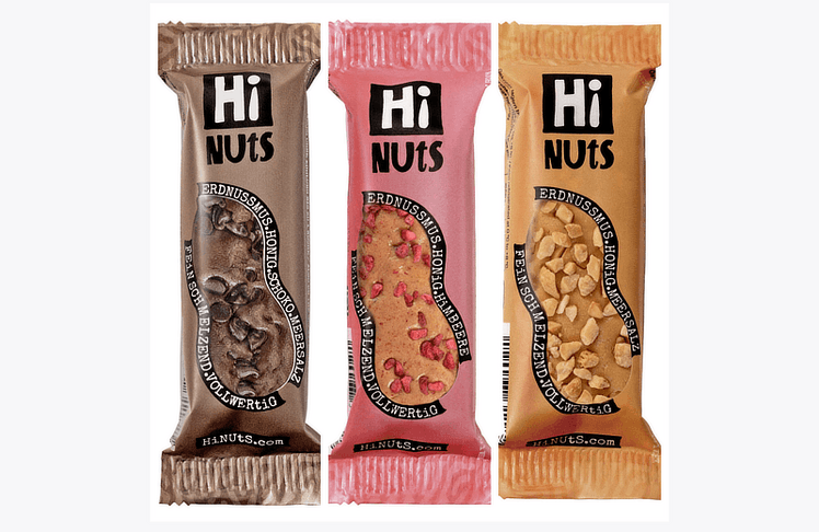 Die HiNUtS-Riegel in den Sorten Schoko, Himbeere und Erdnuss.